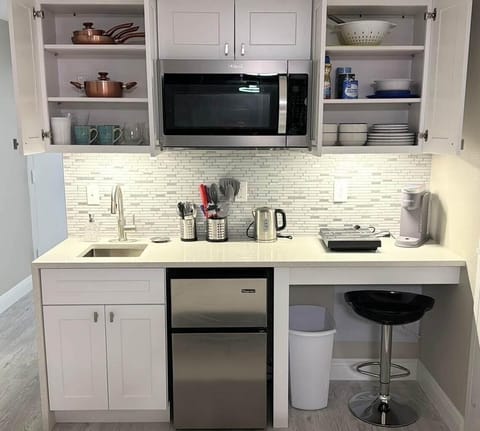 Sparkling quartz countertop kitchenette with breakfast bar & cooking essentials