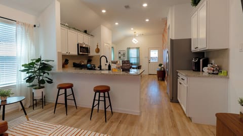 Seamless blend of style and function in our open concept kitchen and living area