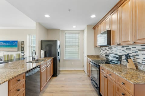 This contemporary kitchen is equipped with ample cabinet space, filled with all the essentials to whip up delicious meals for the whole family.