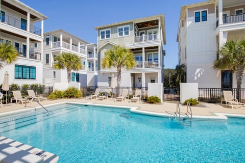 The community pool is only steps away, making it perfect for a quick swim or a day of lounging.