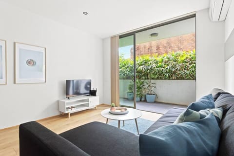  Get cosy in the living room with plush sofa seating and a TV to help relax after a busy day.
