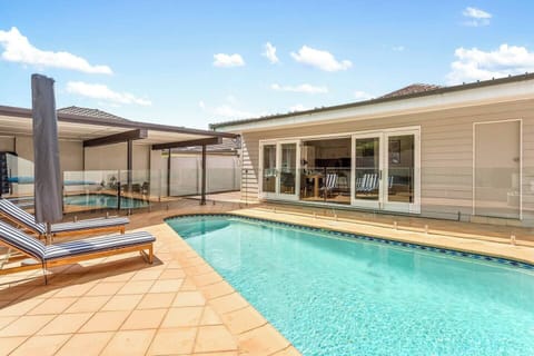 Take a dip in the glistening swimming pool, with sun lounges to relax while delving into a good book.
