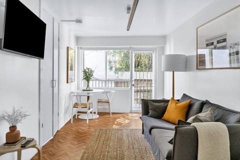 Thoughtful pieces of decor and hanging art make this space truly special. Put your feet up on the large couch and enjoy Netflix on the wall-mounted HD TV. 