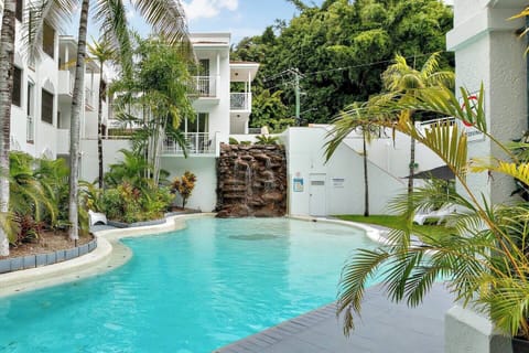 Cool off with a dip in the waterfall swimming pool or unwind on the daybeds with a book.
