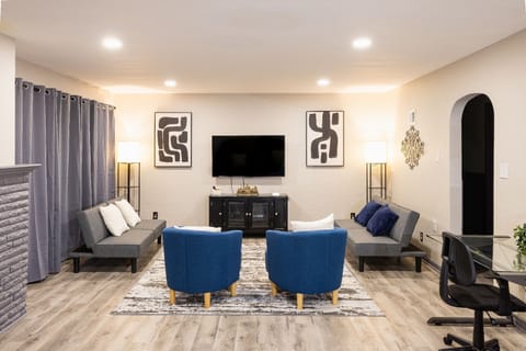 Enjoy the spacious room w/ a 55'' Smart TV, 2 desks and chairs for work or play!