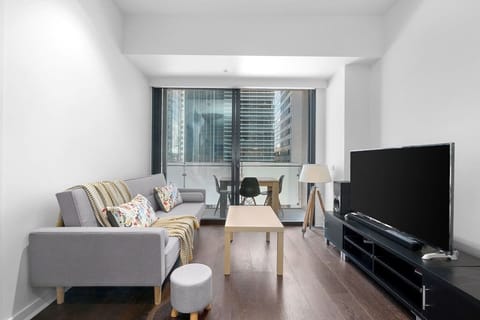 The compact living room flows out to the spacious balcony with alfresco setting.