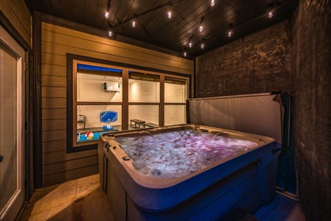 Relax in our 5-person hot tub tucked away in a private outdoor cove!
