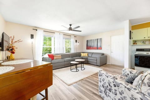 The spacious and light-filled living room offers a comfortable and relaxing environment to unwind after exploring the area.