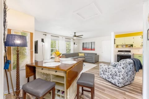 The open concept layout seamlessly blends the living, dining, and kitchen areas, creating a spacious, airy feel throughout.