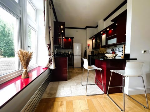 Kitchen with two bar stools