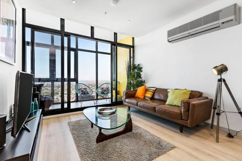 The living room features heating and cooling, plus a plush leather lounge.