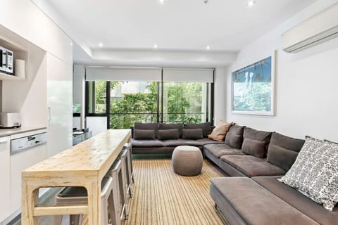 The living room boasts an oversized L-shaped lounge with plenty of room to spread out.