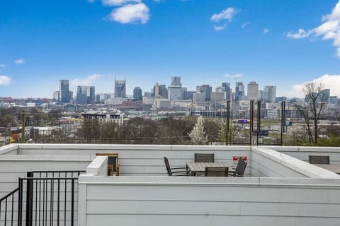 Enjoy sweeping views of the city from this stylish rooftop deck.