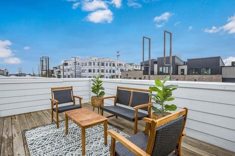 Sleek seating and greenery for relaxed rooftop moments.