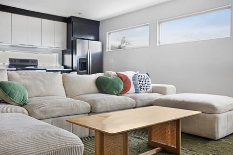 Comfort-forward seating in a well-lit, open-plan living room.