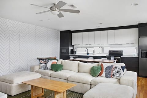 Stylish comfort with a statement wall and full kitchen.