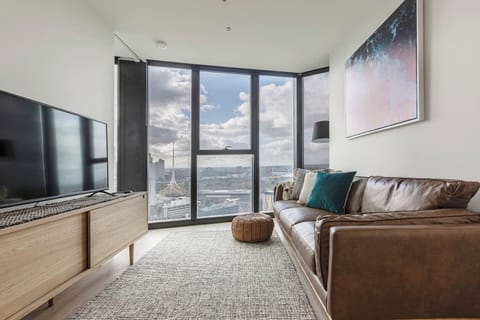 Contemporary timber furniture, sleek modern fixtures and light-washed timber flooring decorate a charming and bright, open-plan space