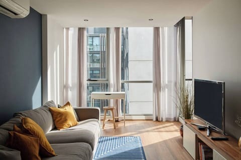 The lounge opens to the balcony and comes with a dedicated study nook, sofa and TV.

