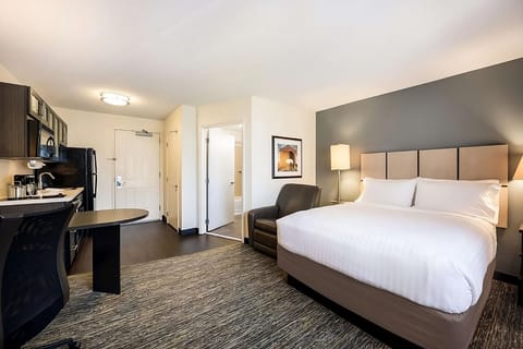 Unwind in a spacious studio with kitchenette and plush bed.