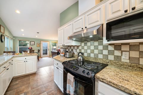 Large kitchen with breakfast bar and All new appliances coming soon.