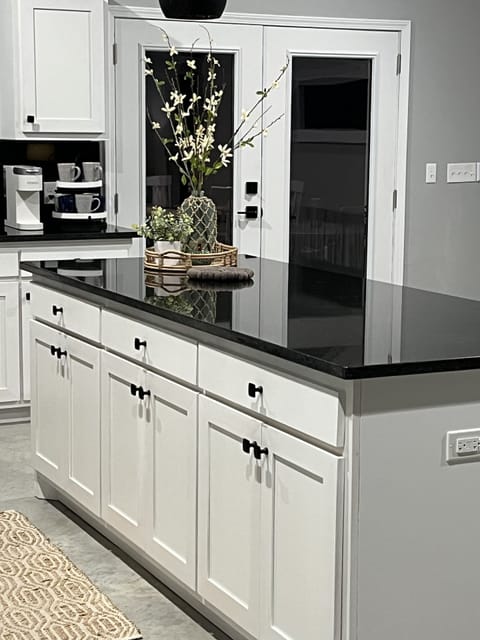 The kitchen island provides food preparation space.