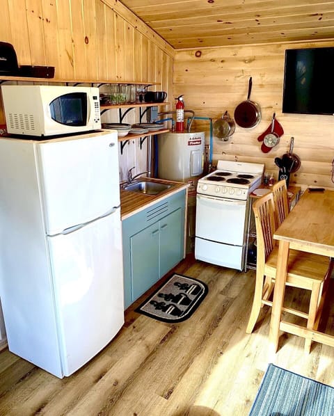 Tiny indeed, but functional. Two additional chairs tucked under table. Pull table out & seat four.