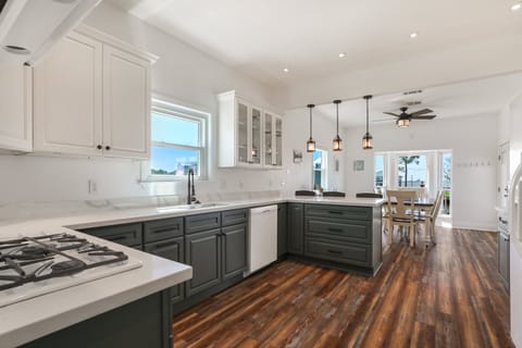 The kitchen has a gas cooktop and double built-in ovens.