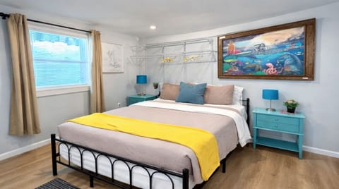 Queen bed with walk around room on each side  of bed and clothing storage above