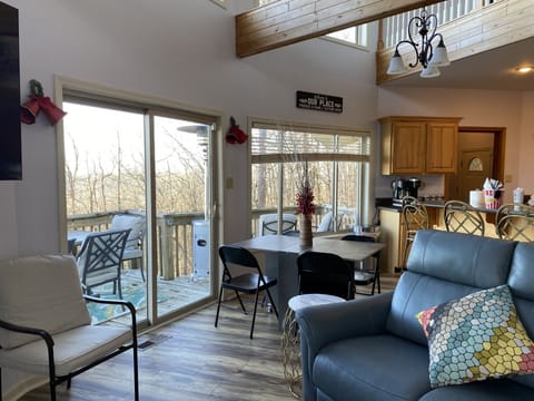 Living room on main floor with convertible dining table.
