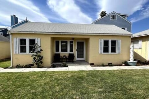View of front of house. House is up drive way and off the street. 