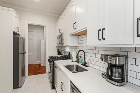 Kitchen with SS Appliances, Inset Kitchen Sink, Quartz Counters, Luxé Faucet and Slow Close Shaker Cabinetry