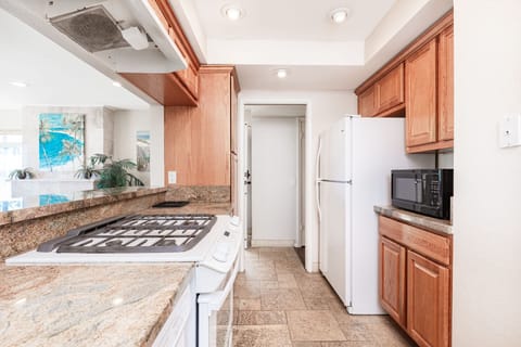 The ground floor kitchen offers a bright, well-appointed space designed for effortless meal preparation
                