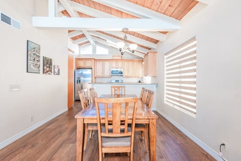 The upper-level dining area features an elegant table with seating for six
                