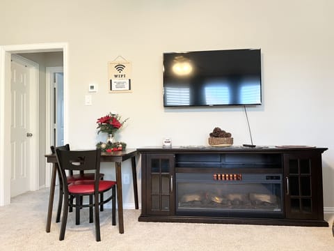 Living room with Smart TV and electric fireplace
