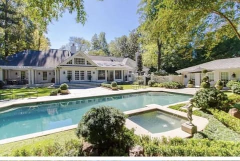 Back of house with pool & hot tub