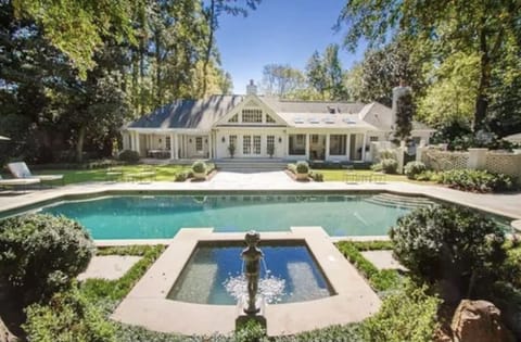 Back of house with pool & hot tub