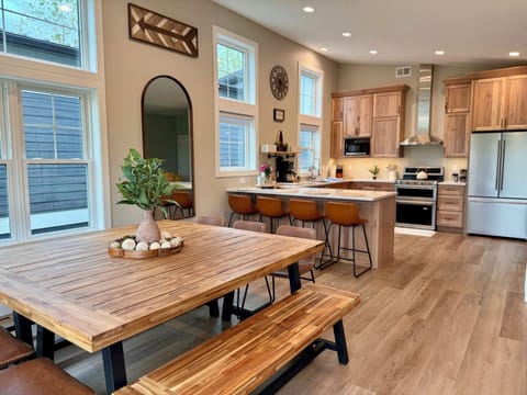 The large, Modern, and gorgeous dining and kitchen area has everything you need.