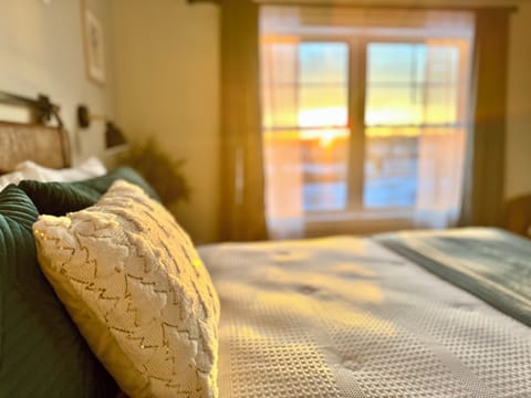 Primary Bedroom with amazing sunrise views directly to Saint Louis River.