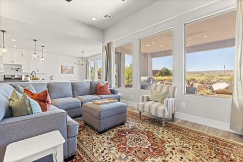 This inviting living room boasts vibrant hues reflecting the beauty of the surrounding desert landscape.