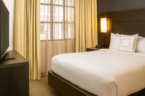 Wake up refreshed in a serene king room with blackout drapes.