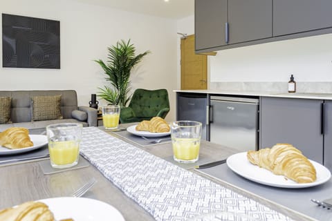 Elegant dining room with a spacious table, perfect for enjoying meals and creating memorable moments with friends and family.