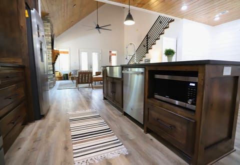 Experience the convenience of a fully equipped kitchen that seamlessly blends into the living space, making it easy to stay connected.