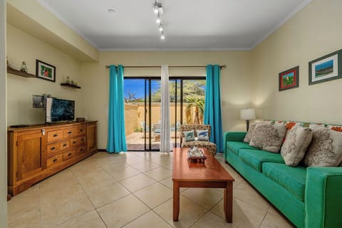Cozy and bright living room with a  view to the outside thru a large sliding door.