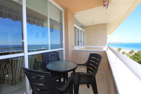 Outdoor dining area for four guests on the balcony with sea views