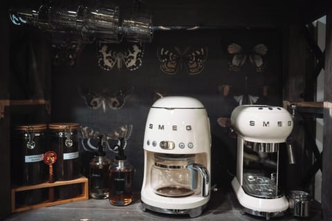 SMEG: Designed in Italy, this retro style coffee & espresso bar is sure to wake you up! 1 of 4 coffee bars in the home! Provided: Coffee, espresso, syrups,  cream & sugar.