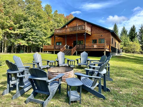 Fire ring with outside seating, backyard, back of house.