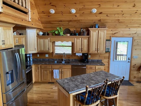 Fully stocked kitchen with all appliances.