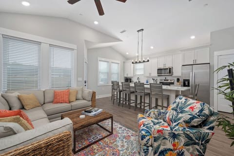 Bright and inviting open-concept living space with coastal charm.