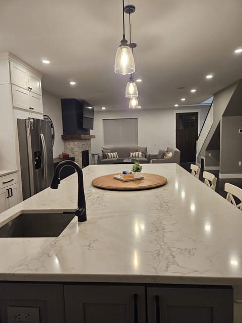 A view from the kitchen sink, highlighting the large island and the prep sink.