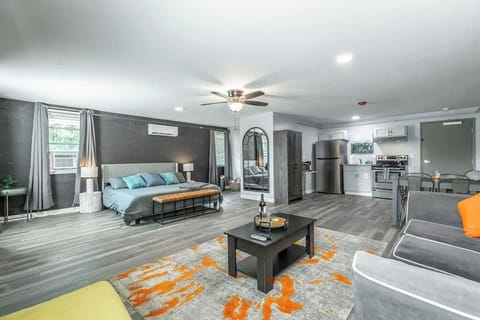 Bright and open studio with king bed, kitchenette, & cozy seating area.
